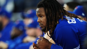 Toronto Blue Jays first baseman Vladimir Guerrero Jr. (27) looks on from the dugout as they face the Seattle Mariners during ninth inning American League wild card MLB post-season baseball action in Toronto on Saturday, October 8, 2022. THE CANADIAN PRESS/Nathan Denette