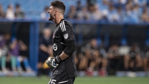 Toronto FC goalkeeper Alex Bono (25) reacts after winning an MLS soccer match against Charlotte FC, Saturday, Aug. 27, 2022, in Charlotte, N.C.THE CANADIAN PRESS/AP-Matt Kelley