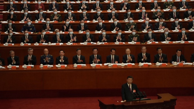 Delegates applaud as Chinese President Xi Jinping 