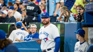 Interim manager John Schneider walks out of the Toronto Blue Jays dugout, before interleague MLB action against the Philadelphia Phillies in Toronto on Wednesday, July 13, 2022. THE CANADIAN PRESS/Christopher Katsarov