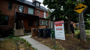 A for lease sign stands in front of a house in Toronto on Tuesday July 12, 2022. THE CANADIAN PRESS/Cole Burston
