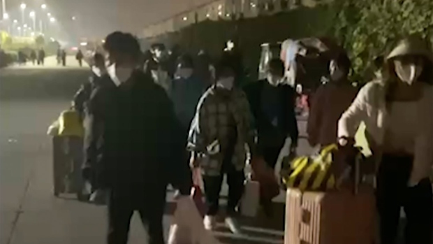 workers at Foxconn compound in Zhengzhou, China