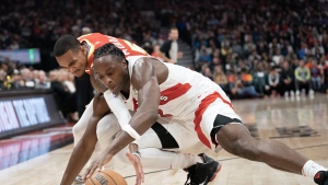 Toronto Raptors forward O.G. Anunoby (3) fights for the ball against Atlanta Hawks guard Dejounte Murray (5) during first half NBA basketball action in Toronto on Monday, October 31, 2022. THE CANADIAN PRESS/Arlyn McAdorey