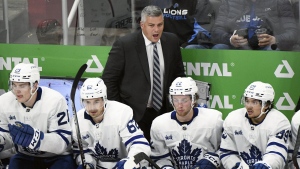 Toronto Maple Leafs head coach Sheldon Keefe, top, yells instructions to his team during the third period of an NHL preseason hockey game, Friday, Oct. 7, 2022, in Detroit. THE CANADIAN PRESS/AP-Jose Juarez