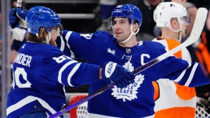 Toronto Maple Leafs' John Tavares (91) celebrates his third goal of the game against the Philadelphia Flyers with teammate William Nylander (88) during third period NHL hockey action in Toronto on Wednesday, November 2, 2022. THE CANADIAN PRESS/Frank Gunn