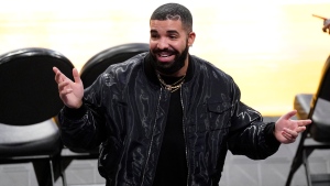 Rapper Drake gestures after watching an NBA basketball Western Conference Play-In game between the Los Angeles Lakers and the Golden State Warriors Wednesday, May 19, 2021, in Los Angeles. The Lakers won 103-100. (AP Photo/Mark J. Terrill) 