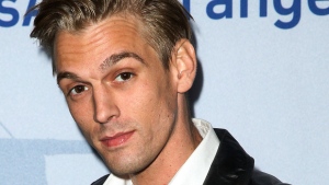 FILE - Singer Aaron Carter arrives at a premiere of "Saints & Strangers" at the Saban Theater in Beverly Hills, Calif., Nov. 9, 2015. Carter, the singer-rapper who began performing as a child and had hit albums starting in his teen years, was found dead Saturday, Nov. 5, 2022, at his home in Southern California. He was 34. (Photo by Rich Fury/Invision/AP, File) 