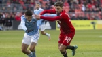 Toronto FC has traded fullback/midfielder Luca Petrasso to Orlando City SC in a deal that could net TFC up to US$400,000 in allocation money. Petrasso (right) challenges for the ball with New York City FC’s Gabriel Pereira during second half MLS action in Toronto on April 2, 2022. THE CANADIAN PRESS/Chris Young