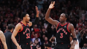 Toronto Raptors forward Otto Porter Jr. (32) and forward O.G. Anunoby (3) celebrate a basket against the Houston Rockets during a break in second half NBA basketball action in Toronto on Wednesday, November 9, 2022. THE CANADIAN PRESS/Nathan Denette 
