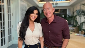 Jeff Bezos and Lauren Sanchez are pictured. Jeff Bezos says he will give most of his money to charity. (CNN)