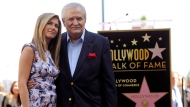 Actress Jennifer Aniston, left, poses with her father, actor John Aniston, after she received a star on the Hollywood Walk of Fame in Los Angeles on Feb. 23, 2012. John Aniston, the Emmy-winning star of the daytime soap opera â€œDays of Our Livesâ€ and father of Jennifer Aniston, has died at age 89. Â The actorâ€™s daughter posted a tribute to him Monday morning on Instagram, announcing that he had died Friday, Nov. 11. (AP Photo/Chris Pizzello, File)