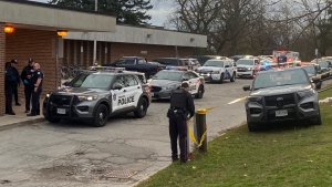 Police are shown outside Birchmount Park Collegiate Institute following a reported stabbing on Monday afternoon. (Jon Woodward)