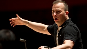 FILE - In this Oct. 17, 2012, file photo, the Philadelphia Orchestra rehearses with its new music director and conductor Yannick Nezet-Seguin at the Kimmel Center, in Philadelphia. (AP Photo/Matt Rourke, File) 