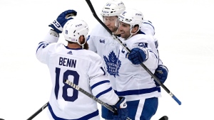 Toronto Maple Leafs' John Tavares, right, celebrates his goal against the Pittsburgh Penguins during the first period of an NHL hockey game in Pittsburgh, Tuesday, Nov. 15, 2022. (AP Photo/Gene J. Puskar)