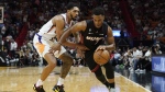 Miami Heat guard Kyle Lowry (7) dribbles around Phoenix Suns guard Cameron Payne (15) during the first half of an NBA basketball game Monday, Nov. 14, 2022, in Miami. THE CANADIAN PRESS/AP-Marta Lavandier