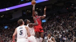 Toronto Raptors O.G. Anunoby shoots over the Miami Heat defence during first half NBA basketball action in Toronto on Wednesday, November 16, 2022. THE CANADIAN PRESS/Chris Young