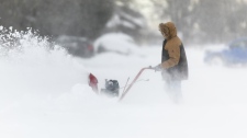 man uses a snowblower in Fort Erie, Ont.