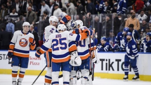 The New York Islanders celebrate after defeating the Toronto Maple Leafs 3-2 in overtime NHL action, in Toronto, Monday, Nov. 21, 2022. THE CANADIAN PRESS/Christopher Katsarov