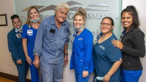 Jay Leno has been discharged from the hospital after sustaining burn injuries in a gasoline fire. Leno is seen here with the staff of the Grossman Burn Center on November 21. (Grossman Burn Center)