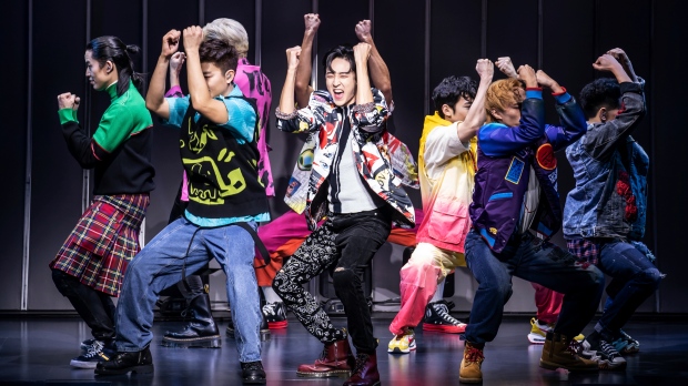 This image released by O+M/DKC shows Kevin Woo, center, and the cast during a performance of 'KPOP,' opening Nov. 27 at the Circle in the Square Theatre in New York. (Matthew Murphy/O+M/DKC via AP)