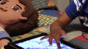 The Canadian Paediatric Society is no longer recommending firm time limits for screen use among toddlers and preschoolers. Instead, new guidance encourages parents of kids aged two-to-five to prioritize educational, interactive and age-appropriate material. In this Oct. 21, 2011, file photo, a child plays with an iPad in his bedroom. THE CANADIAN PRESS/AP-Gerald Herbert