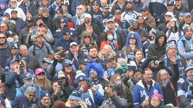 Toronto Argonauts fans watch the team's Grey Cup victory rally at Maple Leaf Square in Toronto on Nov. 24, 2022. 