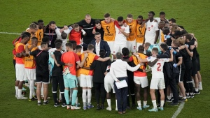 Canada's head coach John Herdman talks with his team after their loss in the World Cup group F soccer match between Belgium and Canada, at the Ahmad Bin Ali Stadium in Doha, Qatar, Wednesday, Nov. 23, 2022. (AP Photo/Ariel Schalit)