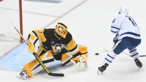 Right wing Mitchell Marner scores on Pittsburgh Penguins goalie Casey DeSmith during the first period of a hockey game, Saturday, Nov. 26, 2022, in Pittsburgh. (AP Photo/Philip G. Pavely)