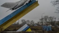 Cars leave Kherson, southern Ukraine, Saturday, Nov. 26, 2022. Fleeing shelling, hundreds of civilians on Saturday streamed out of the southern Ukrainian city whose recapture they had celebrated just weeks earlier. (AP Photo/Bernat Armangue)