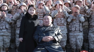 This undated photo provided on Nov. 27, 2022, by the North Korean government shows North Korean leader Kim Jong Un, center right, and his daughter, center left, with soldiers, pose for a photo, following the launch of what it says a Hwasong-17 intercontinental ballistic missile, at an unidentified location in North Korea. Independent journalists were not given access to cover the event depicted in this image distributed by the North Korean government. The content of this image is as provided and cannot be independently verified. Korean language watermark on image as provided by source reads: "KCNA" which is the abbreviation for Korean Central News Agency. (Korean Central News Agency/Korea News Service via AP)