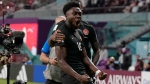 Canada's Alphonso Davies celebrates after scoring his side's opening goal during the World Cup group F soccer match between Croatia and Canada, at the Khalifa International Stadium in Doha, Qatar, Sunday, Nov. 27, 2022. (AP Photo/Thanassis Stavrakis)