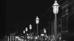 Gas lamps illuminate St. Louis' Gaslight Square on April 2, 1962. 'Gaslighting' — mind manipulating, grossly misleading, downright deceitful — is Merriam-Webster's word of 2022. (AP Photo/JMH, File)