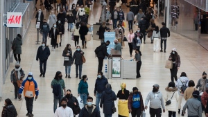 People navigate through Yorkdale Mall in search of Black Friday sales in Toronto on November 26, 2021. When Shopify Inc.'s Harley Finkelstein surveys November's retail landscape, he finds it hard to see where Black Friday stops and Cyber Monday begins. The annual pre-holiday sales blitzes meant to encourage customers to drop cash on discounted goods have bled together in recent years, with stores extending Black Friday promotions beyond a single day and online retailers offering Cyber Monday deals all week -- or all month. THE CANADIAN PRESS/Tijana Martin