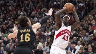 Toronto Raptors’ Pascal Siakam, right, scores on Cleveland Cavaliers’ Cedi Osman during first half NBA basketball action in Toronto, Monday, Nov. 28, 2022. Back after a 10-game absence, Siakam scored Toronto's first points of the game en route to 18 points and 11 rebounds to help the Raptors to a 100-88 win over the Cleveland Cavaliers on Monday. THE CANADIAN PRESS/Chris Young