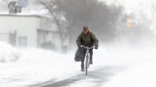 A man rides his bike in Fort Erie, Ont.