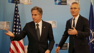 U.S. Secretary of State Antony Blinken, left, gestures with NATO Secretary-General Jens Stoltenberg in Bucharest, Romania, Tuesday, Nov. 29, 2022. Blinken attends the meeting of NATO Ministers of Foreign Affairs in the Romanian capital. (AP Photo/Vadim Ghirda, Pool)