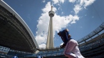 Members of the Toronto Blue Jays take to the field before MLB baseball action in Toronto on Saturday, May 24, 2014. THE CANADIAN PRESS/Darren Calabrese