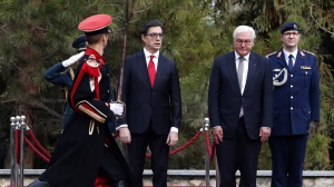 German President Frank-Walter Steinmeier, center right and North Macedonia's President Stevo Pendarovski, center left, walk together during a welcome ceremony at the presidential palace in Skopje, North Macedonia, on Tuesday, Nov. 29, 2022. German President Steinmeier is on a two-day official visit to North Macedonia. (AP Photo/Boris Grdanoski)