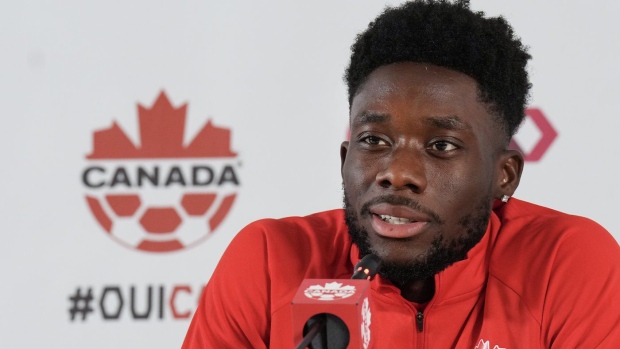 Canada forward Alphonso Davies speaks to the media after practice at the World Cup in Doha, Qatar on Tuesday, November 29, 2022. THE CANADIAN PRESS/Nathan Denette