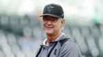 Miami Marlins manager Don Mattingly smiles after throwing a ball to fans before a baseball game against the Milwaukee Brewers, Saturday, Oct. 1, 2022, in Milwaukee. The Toronto Blue Jays have hired Mattingly to serve as bench coach under manager John Schneider. THE CANADIAN PRESS/AP-Jon Durr