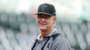 Miami Marlins manager Don Mattingly smiles after throwing a ball to fans before a baseball game against the Milwaukee Brewers, Saturday, Oct. 1, 2022, in Milwaukee. The Toronto Blue Jays have hired Mattingly to serve as bench coach under manager John Schneider. THE CANADIAN PRESS/AP-Jon Durr