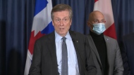 Mayor John Tory speaks with reporters at Toronto City Hall. 