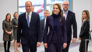 In this photo provided by the Massachusetts Governor's Press Office, Britain's Prince William, and Kate, Princess of Wales, arrive at Boston Logan International Airport on Wednesday, Nov. 30, 2022, in Boston. The Prince and Princess of Wales are making their first overseas trip since the death of Queen Elizabeth II in September. (Joshua Qualls/Massachusetts Governor's Press Office via AP)