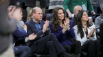 Britain's Prince William; Kate, Princess of Wales; and Emilia Fazzalari, wife of Boston Celtics majority owner Wyc Grousbeck, from left, attend the NBA basketball game between the Celtics and the Miami Heat on Wednesday, Nov. 30, 2022, in Boston. (Brian Snyder/Pool Photo via AP)