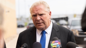 Ontario Premier Doug Ford speaks to reporters in Innisfil, Ont., on Wednesday, Oct 12, 2022. THE CANADIAN PRESS/Arlyn McAdorey