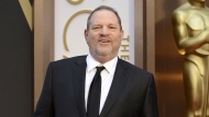 FILE - Movie mogul Harvey Weinstein arrives at the Oscars at the Dolby Theatre in Los Angeles, March 2, 2014. Jennifer Siebel Newsom, a documentary filmmaker and the wife of California governor Gavin Newsom, has taken the stand at Weinstein's trial. Newsom is the fourth of the women Weinstein is accused of assaulting to testify at his Los Angeles trial. (Photo by Jordan Strauss/Invision/AP, File)