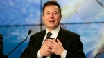 FILE - In this Sunday, Jan. 19, 2020. file photo, Elon Musk founder, CEO, and chief engineer/designer of SpaceX speaks during a news conference after a Falcon 9 SpaceX rocket test flight to demonstrate the capsule's emergency escape system at the Kennedy Space Center in Cape Canaveral, Fla. (AP Photo/John Raoux, File) 