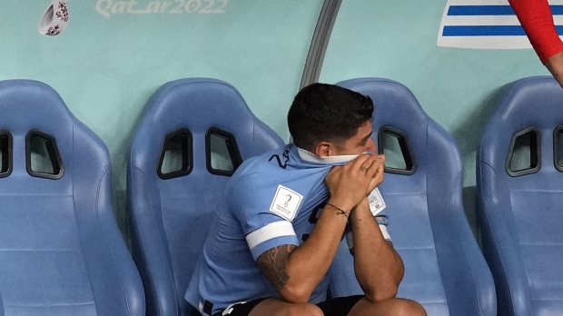 Uruguay's Luis Suarez sits on the bench during the World Cup group H soccer match between Ghana and Uruguay, at the Al Janoub Stadium in Al Wakrah, Qatar, Friday, Dec. 2, 2022. (AP PhotoThemba Hadebe)
