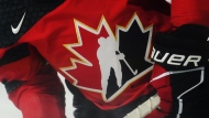 A Team Canada logo is shown on a player during the warm-up prior to Rivalry Series hockey action against the United States in Kamloops, B.C., Thursday, Nov. 17, 2022. Hockey Canada says there were more than 900 documented or alleged incidents of on-ice discrimination -- verbal taunts, insults and intimidation -- across all levels and age groups during the 2021-22 season. THE CANADIAN PRESS/Jesse Johnston