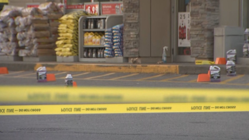 Police tape surrounds the front entrance of a gas station in Mississauga where a 21-year-old woman was fatally shot on Saturday, Dec. 3.